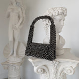 EMMA HANDHELD CLUTCH