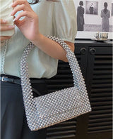 EMMA HANDHELD CLUTCH