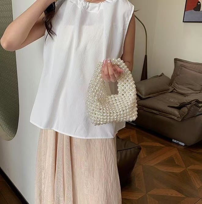 MOTHER OF PEARL HANDHELD CLUTCH