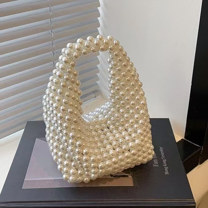 MOTHER OF PEARL HANDHELD CLUTCH